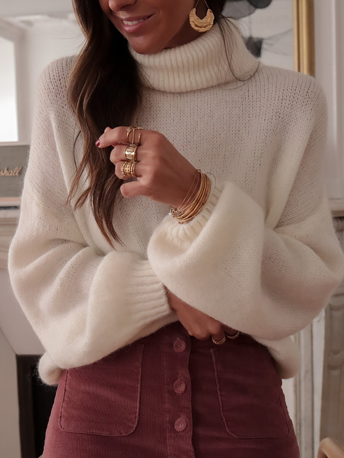 100% polyester Care instructions: Machine wash cold turtleneck sweater in White with oversized silhouette