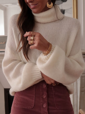 100% polyester Care instructions: Machine wash cold turtleneck sweater in White with oversized silhouette