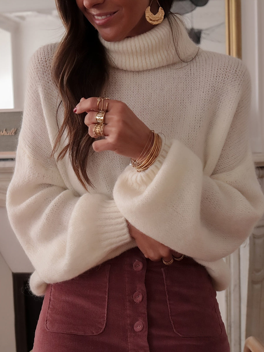 100% polyester Care instructions: Machine wash cold turtleneck sweater in White with oversized silhouette