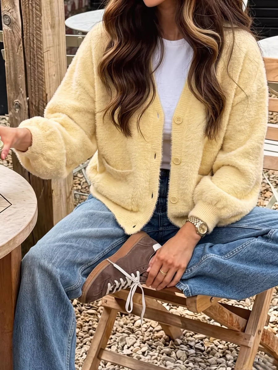 100% polyamide Care instructions: Machine wash cold cardigan in pale yellow with relaxed silhouette