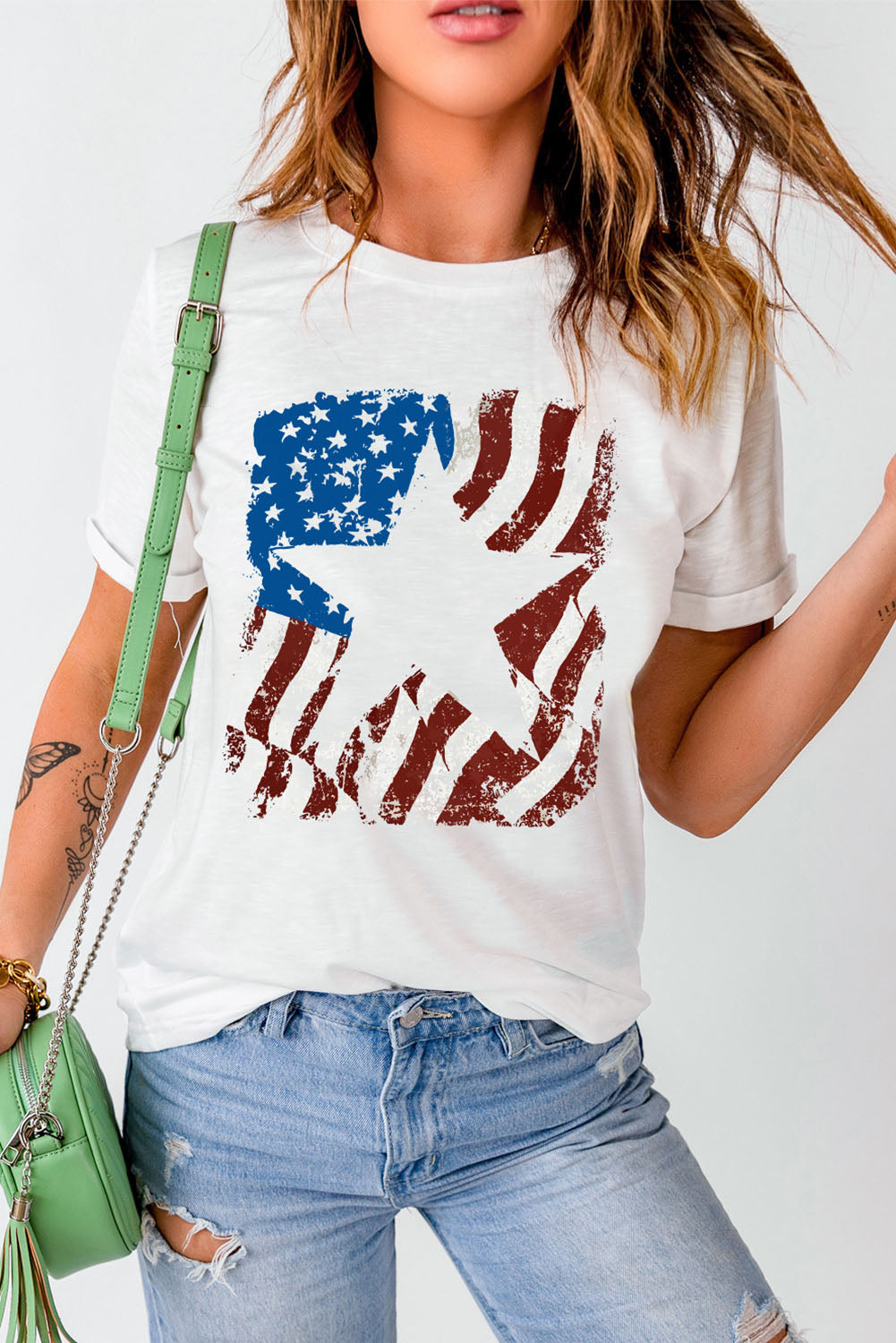 White round neck t-shirt with distressed American flag graphic and star detail.