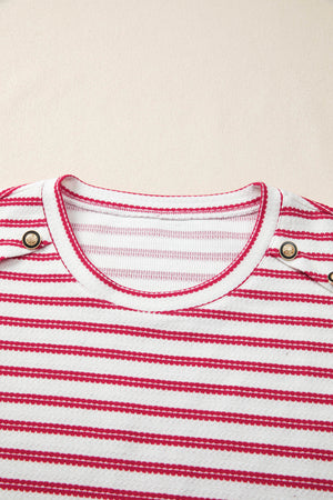 Textured knit tee with red stripes, crew neck, and decorative button detail.