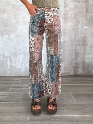 flare pants in cream featuring raw hem and flared fit