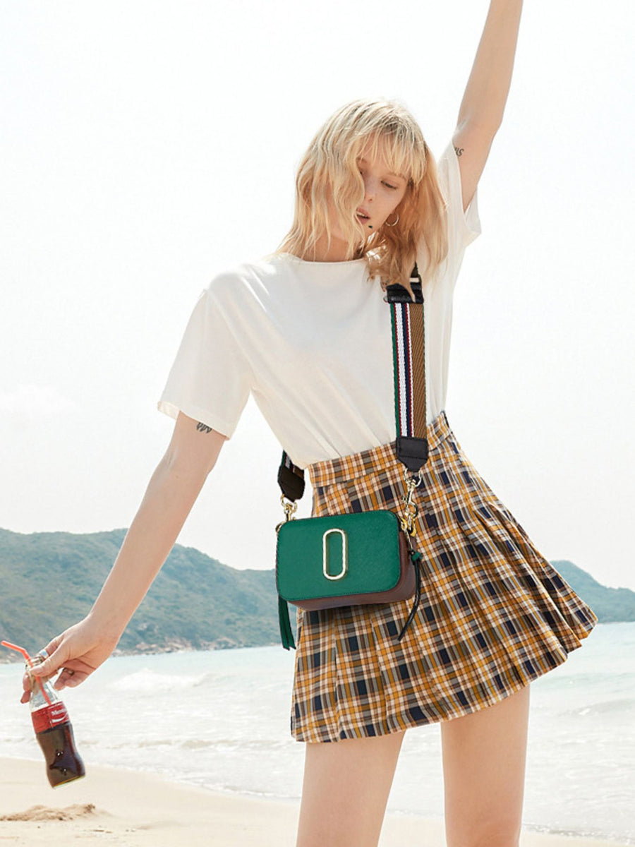 dark brown crossbody bag featuring adjustable strap and color-block