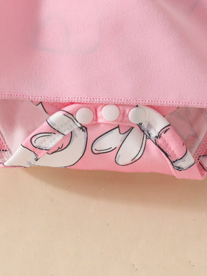 Pink baby dress with bunny print detail and snap closure