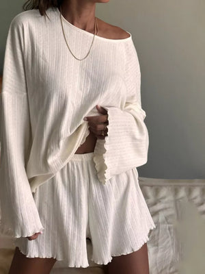 White ribbed knit lounge set with lettuce trim shorts and off-the-shoulder top.