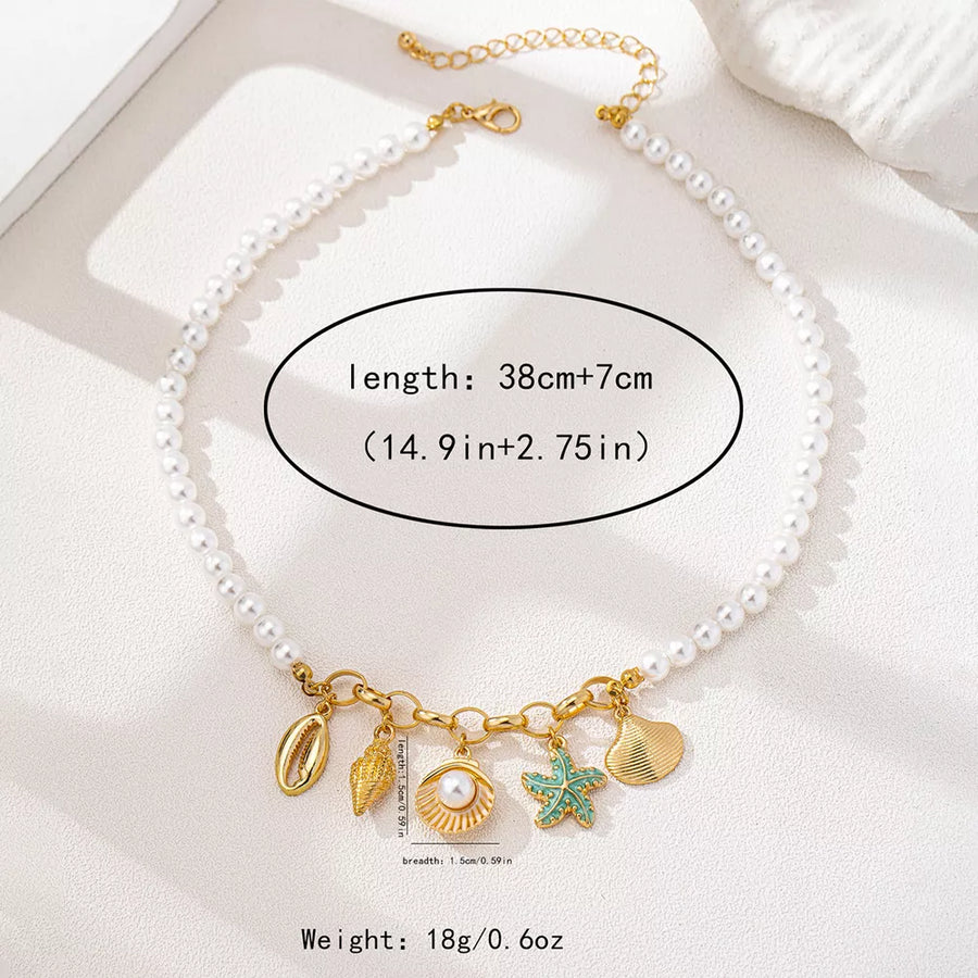 necklace in ivory with charm details and choker