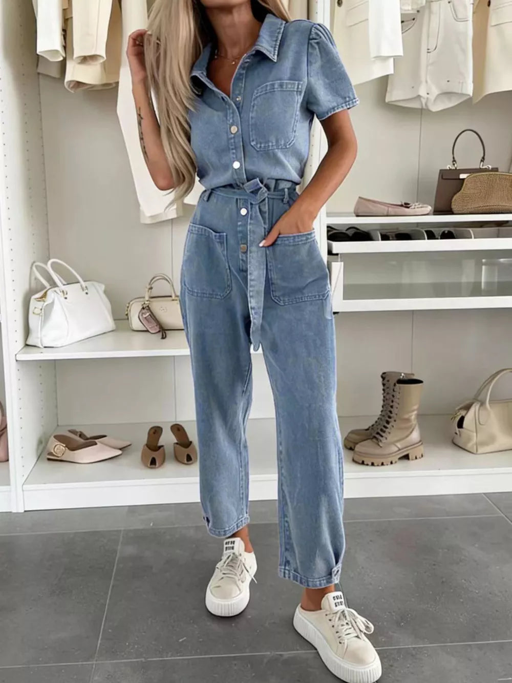 jumpsuit in light wash denim featuring buttoned and relaxed fit
