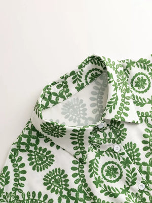 Green printed tie-waist romper with button front and collar detail