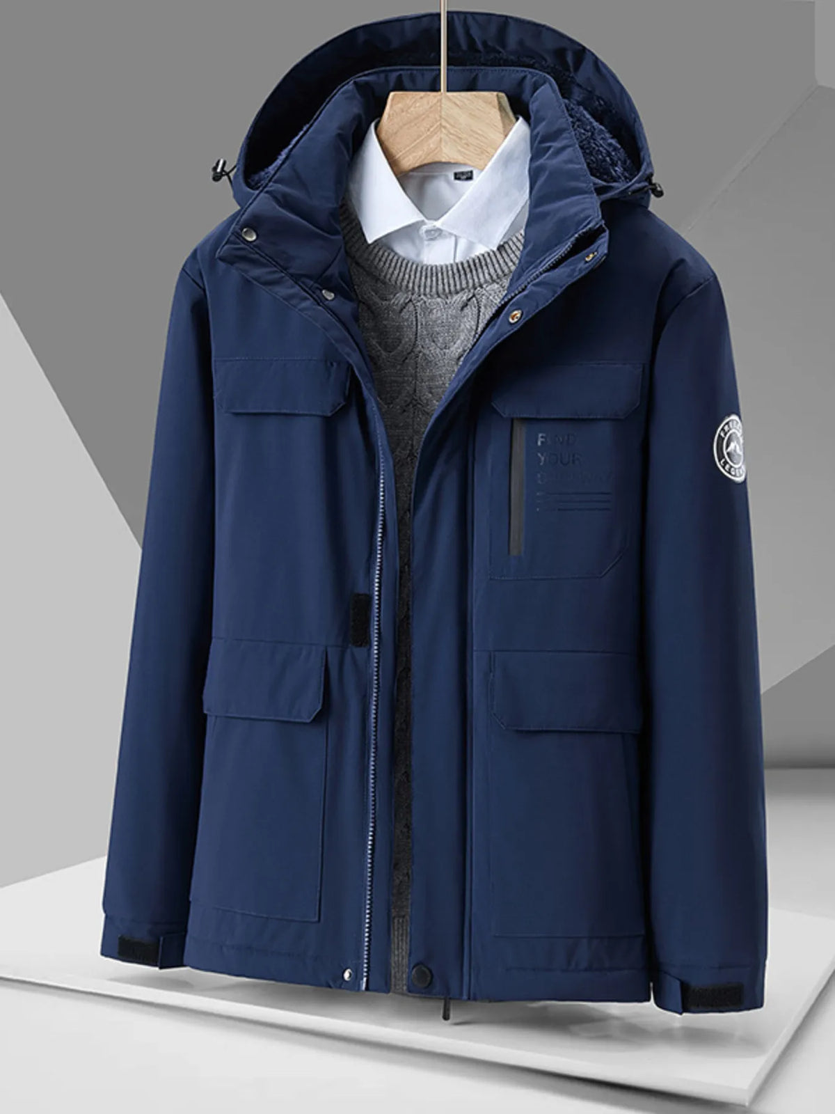 Plus-size hooded puffer jacket in Indigo with multiple pockets and a zip closure.