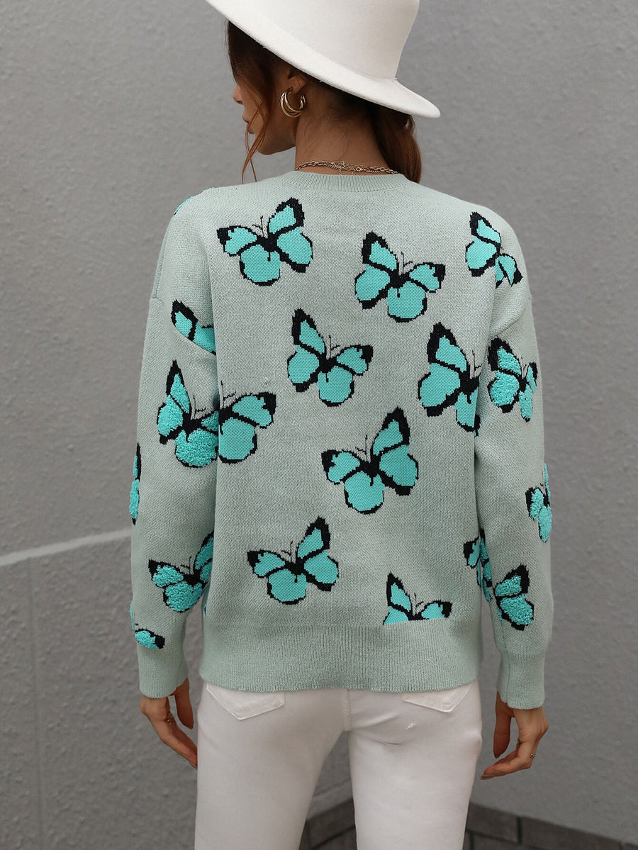 Sky blue knit crewneck sweater with allover butterfly motif.