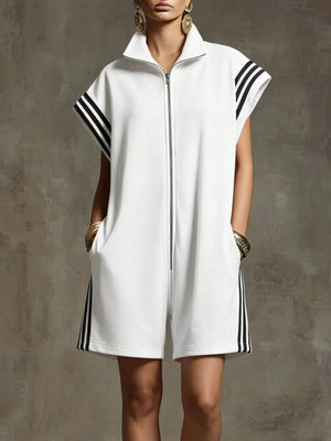 White zip-up romper with black stripes on sleeves and sides, pockets, and collar.