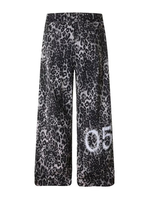 Leopard print cotton sweatpants with drawstring waist and wide legs, featuring a "05" graphic detail.
