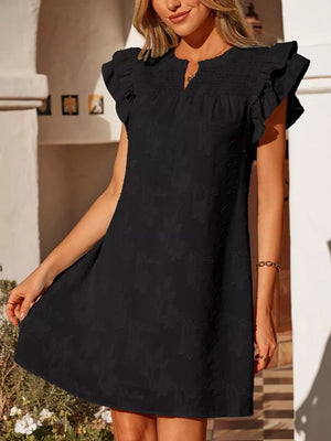 Black floral embossed mini dress with smocked bodice and ruffled sleeves.