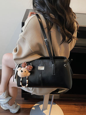 black with handbag with shoulder strap