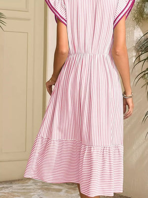 Pink striped midi dress with ruffle sleeves and tiered hem.