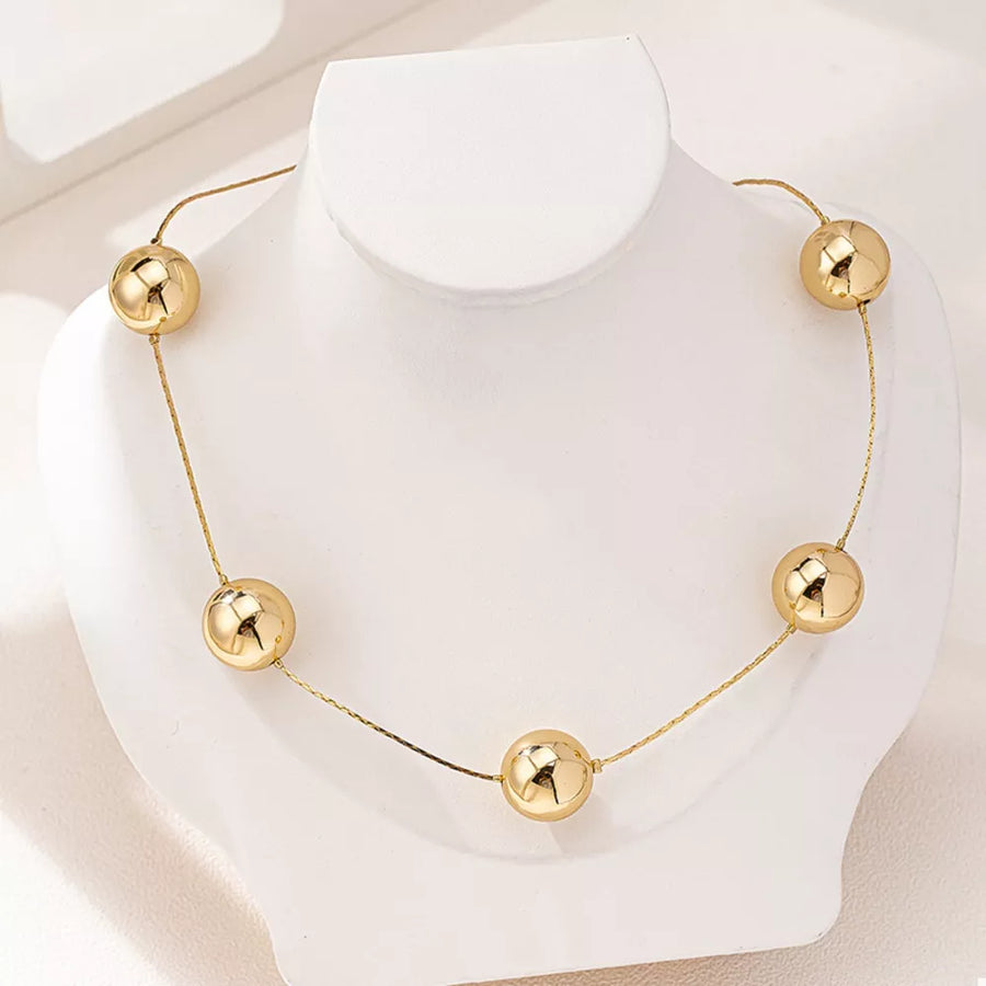 gold necklace with short and hook-and-eye