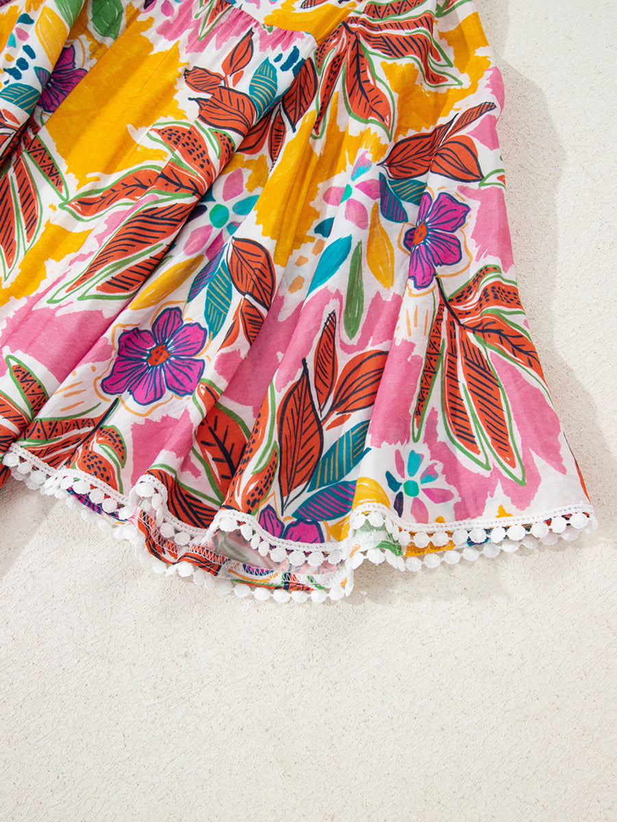Print bell sleeve mini dress with colorful floral pattern and pom-pom trim hem