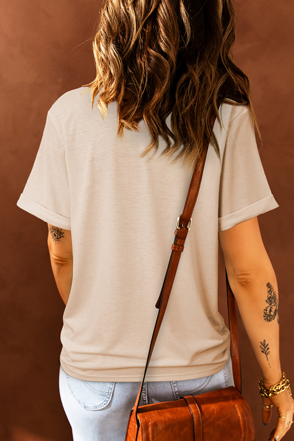 Khaki crew neck t-shirt with cuffed short sleeves and a relaxed fit.