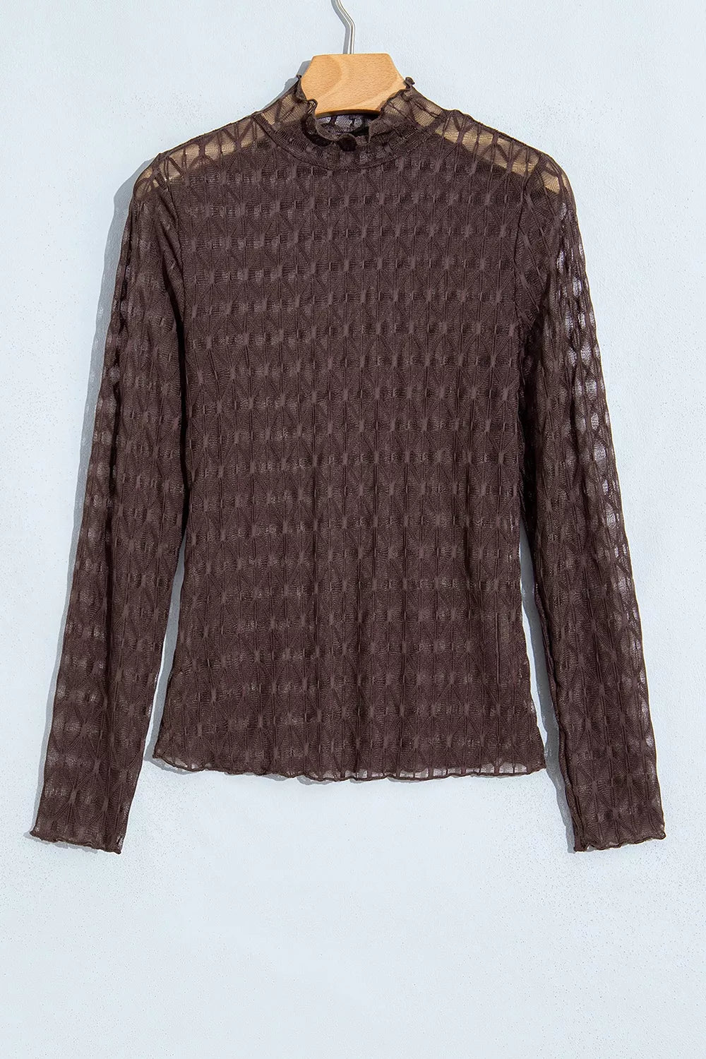 90% polyamide, 10% elastane Care instructions: Machine wash cold blouse in dark brown with fitted silhouette