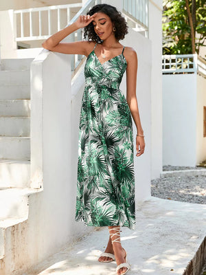 Chic floral midi dress with spaghetti straps in green palm print.