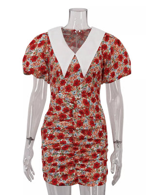 Floral print mini dress with white collar, puff sleeves, and ruched detail