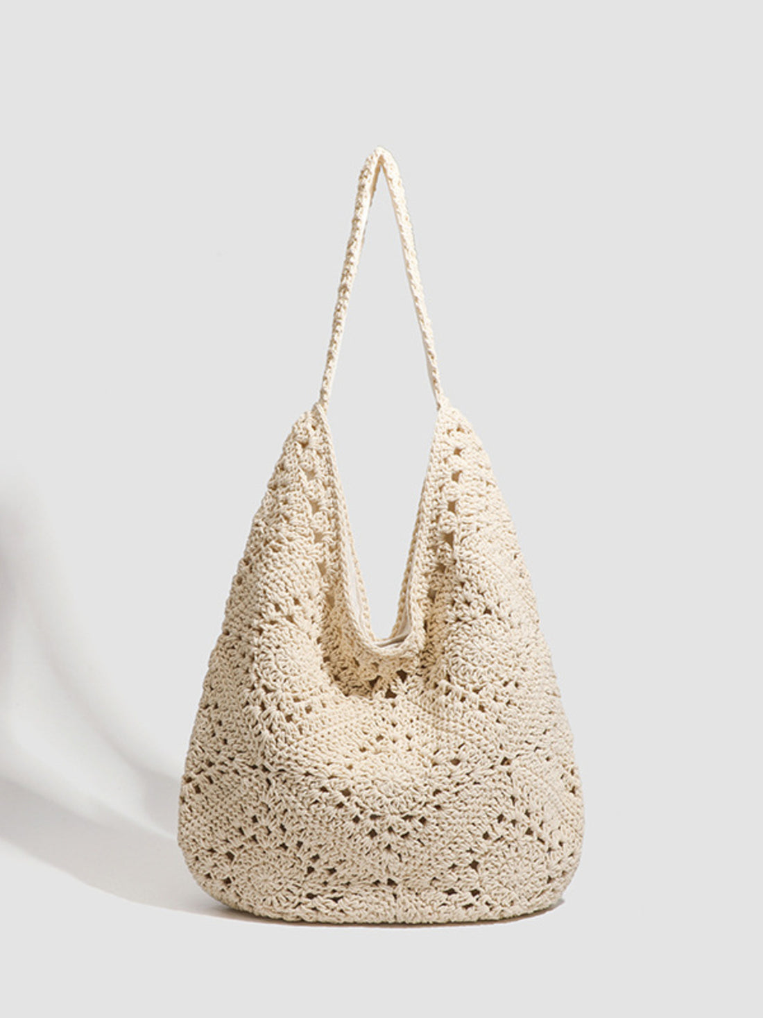 tote in cream featuring hollow-out and relaxed fit