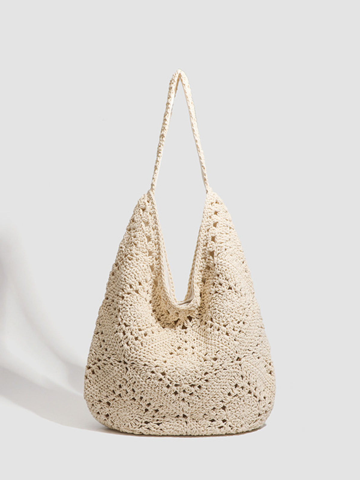tote in cream featuring hollow-out and relaxed fit