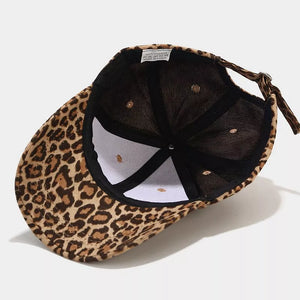 brown cap featuring curved brim and leopard