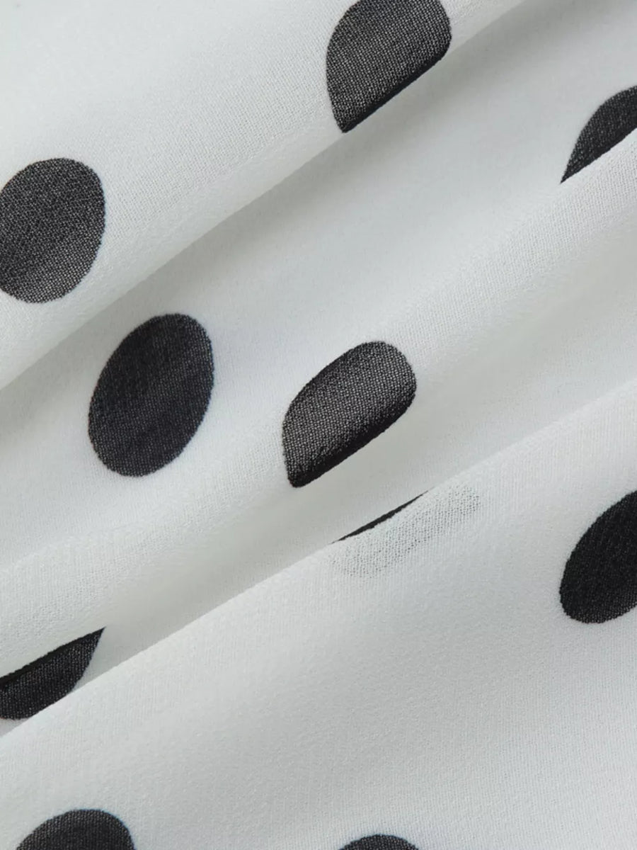 White mini dress with black polka dots and ruched detail