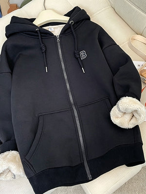 95% polyester, 5% elastane Care instructions: Machine wash cold zip hoodie in Black with relaxed silhouette