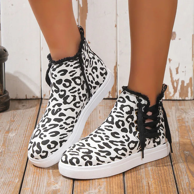 Canvas leopard print zip-up sneaker booties with lace-up back detail.