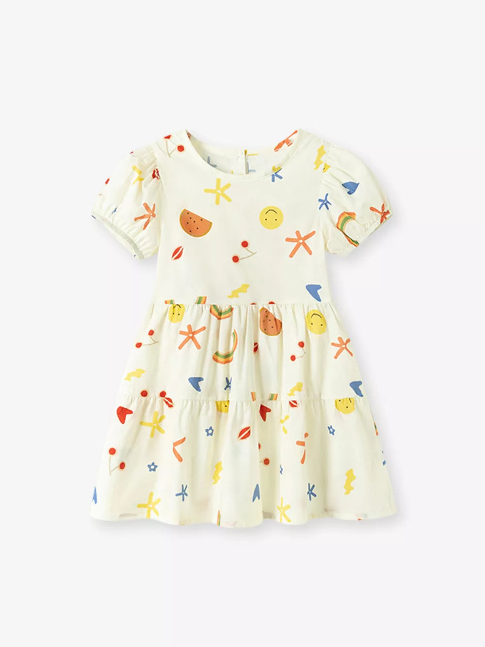 Kids' tiered dress in cream with playful fruit, smiley face, and rainbow print.