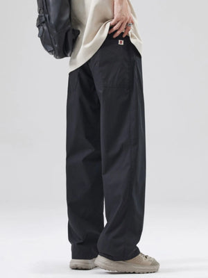 Black oversized casual pants with a loose fit and cotton blend material.