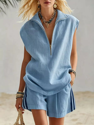 Blue linen blend sleeveless zip-neck top and striped shorts set.