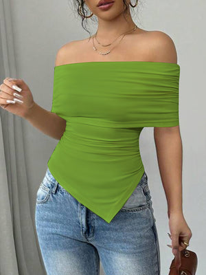 Green asymmetrical ruched off-shoulder top with a handkerchief hem.