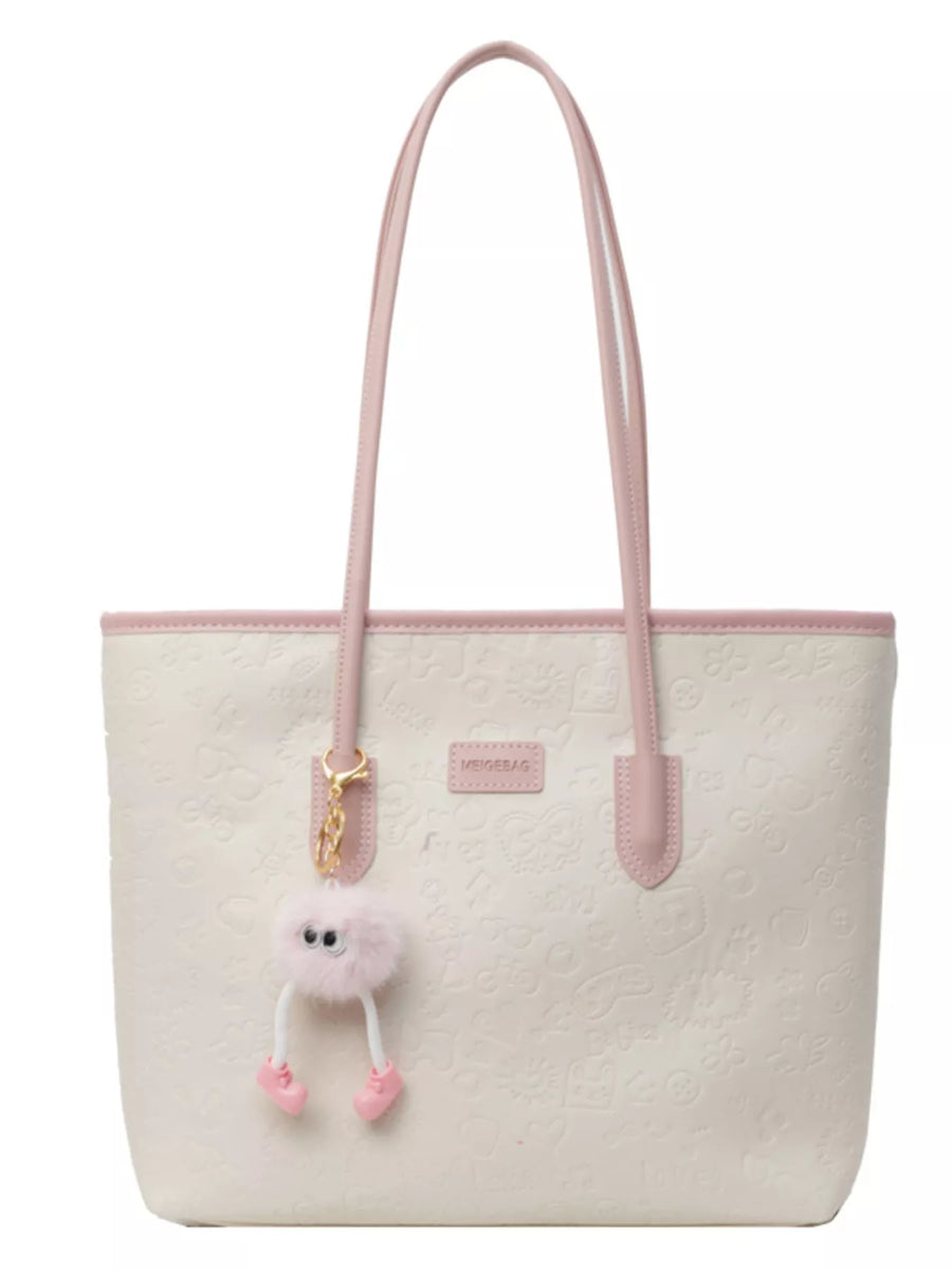 Embossed PU leather tote bag in cream with pink trim and handles, featuring a cute fuzzy charm.