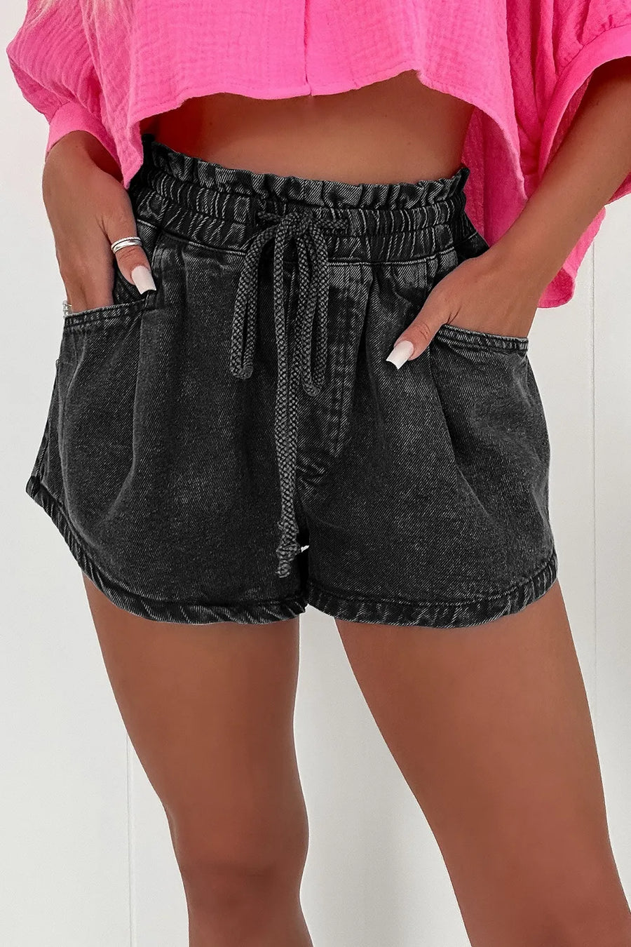 Black denim paperbag waist shorts with drawstring and relaxed fit
