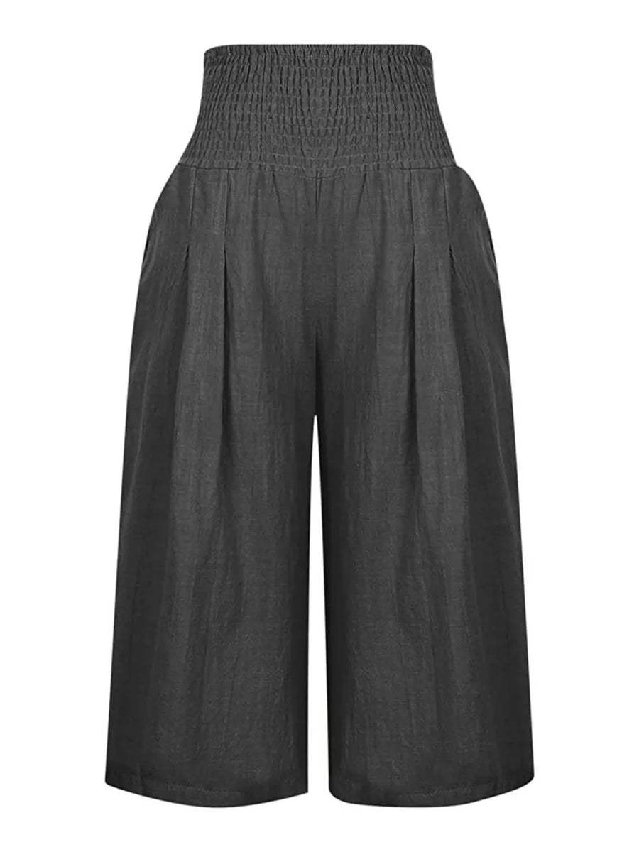 Dark gray linen blend culottes with smocked high waist and wide legs.