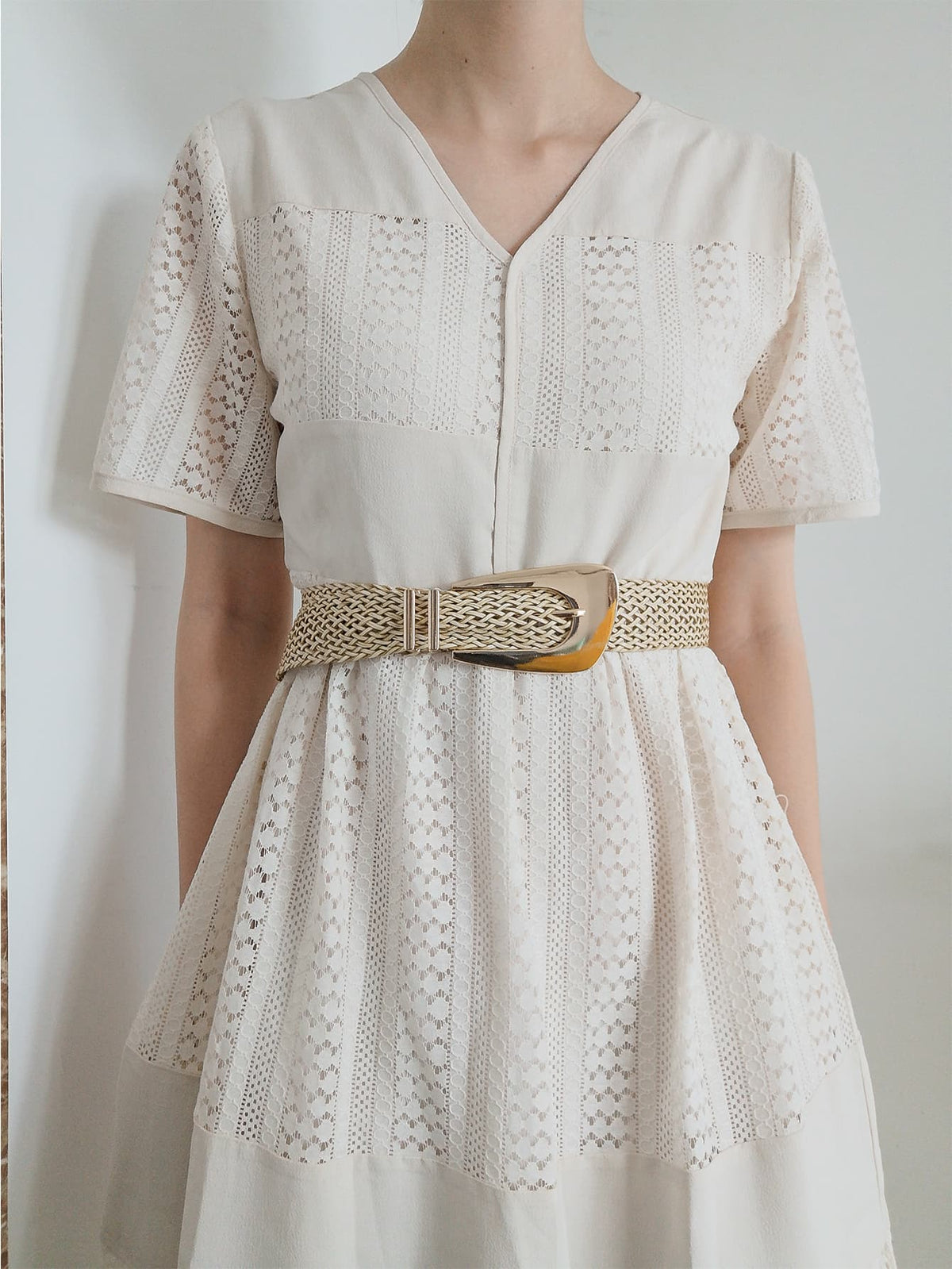 Woven raffia belt with gold-tone buckle and alloy details.