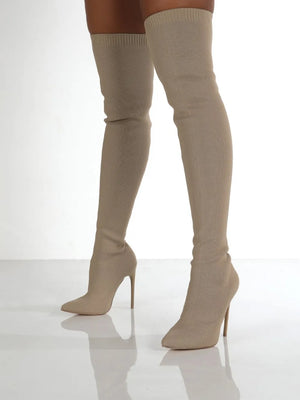 Beige knit over-the-knee stiletto booties with pointed toe and stiletto heel.