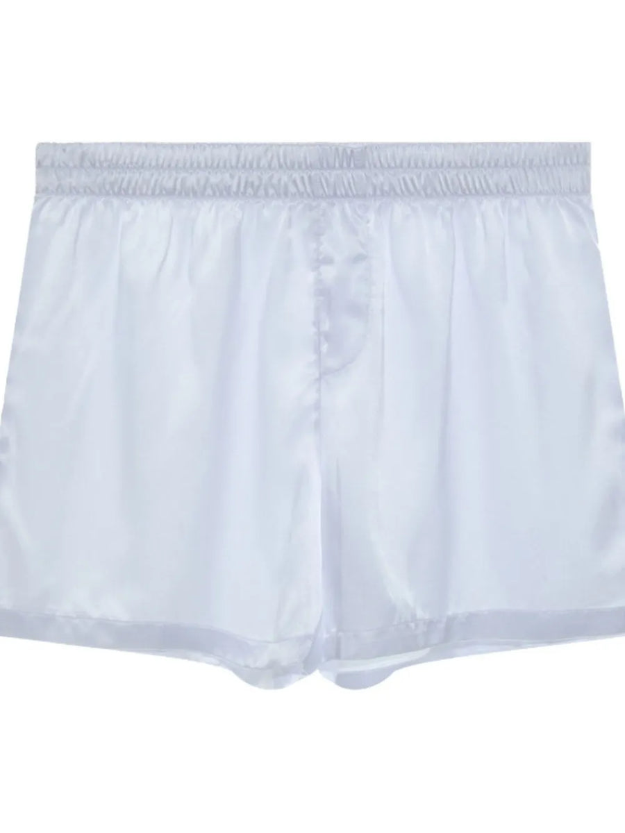 White satin boxer shorts with elastic waistband and button fly.