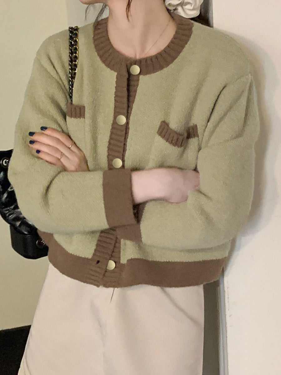 Green acrylic button up cardigan with contrast trim and gold buttons.