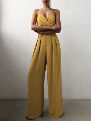 Yellow ruched spaghetti strap wide-leg jumpsuit with sweetheart neckline and pleated details.