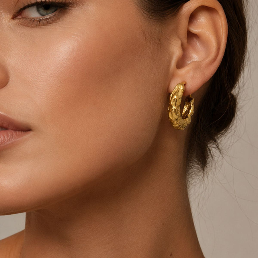 Gold earrings featuring gold-plated and textured