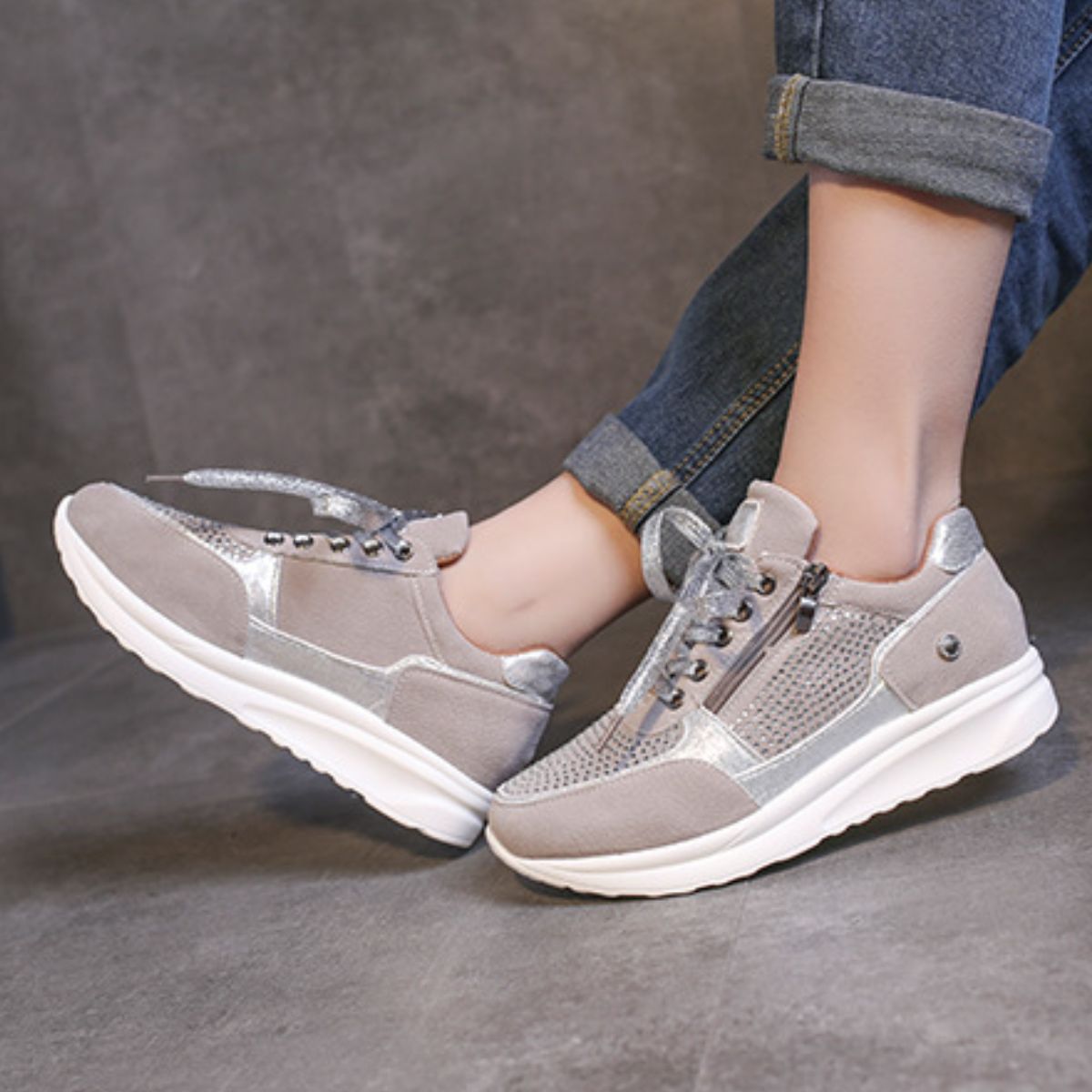 Grey rhinestone embellished lace-up sneakers with chunky sole and side zipper detail.
