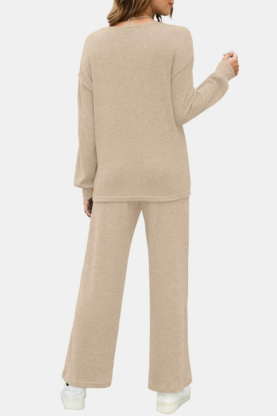 Ribbed knit lounge set in tan, featuring a relaxed fit sweater and wide-leg pants.
