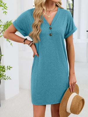 Blue-green t-shirt dress with V-neck, short sleeves, and decorative buttons.