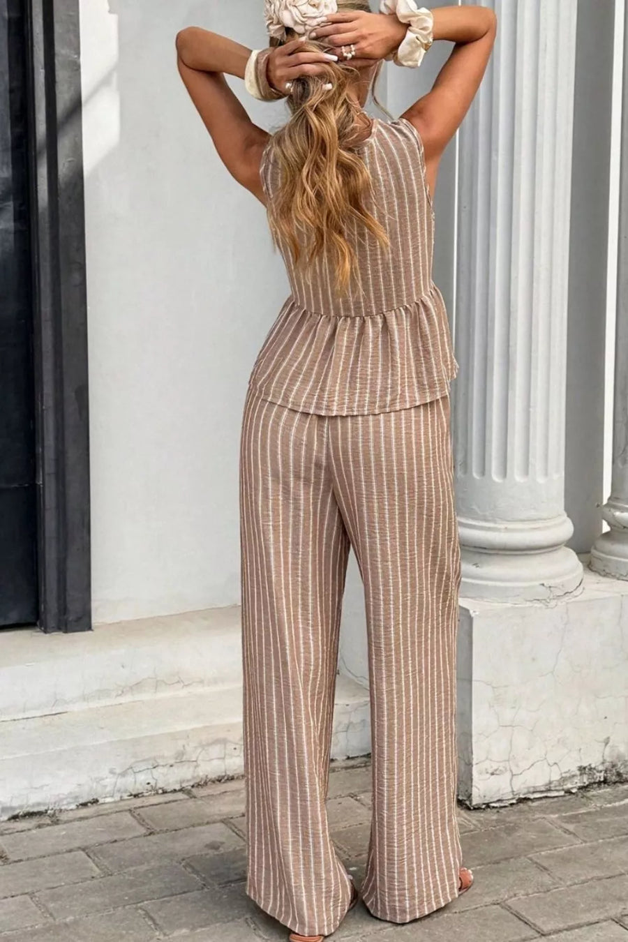 Chic striped two-piece set in camel with peplum top and wide-leg pants.