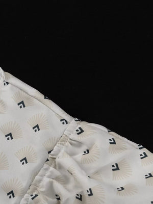 White blouse with fan and square pattern, gathered neckline detail